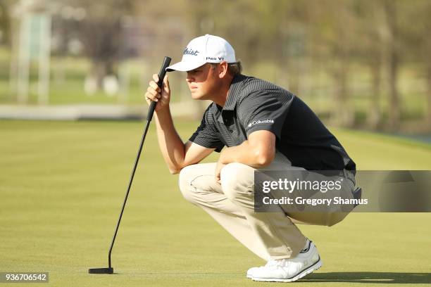 Patton Kizzire of the United States lines up a putt on the 14th green during the second round of the World Golf Championships-Dell Match Play at...