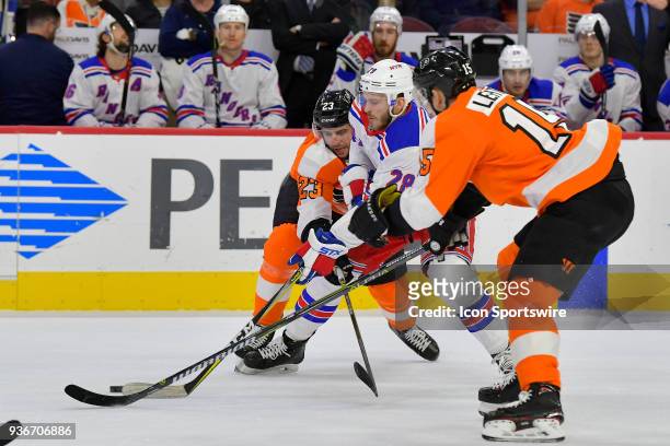 Philadelphia Flyers defenseman Brandon Manning New York Rangers center Paul Carey and Philadelphia Flyers center Jori Lehtera vie for the puck during...