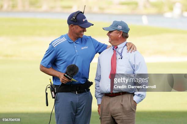 Golf channel personality Jim "Bones" Mackay talks to rules official Brad Fabel during the second round of the World Golf Championships-Dell Match...