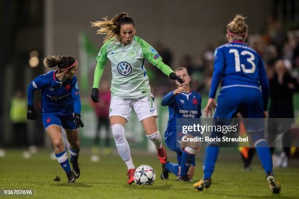 Sara Bjoerk Gunnarsdottir of VfL Wolfsburg is challenged by Petra Divisova of Slavia Praha during the UEFA Women's Champions League Quarter Final...