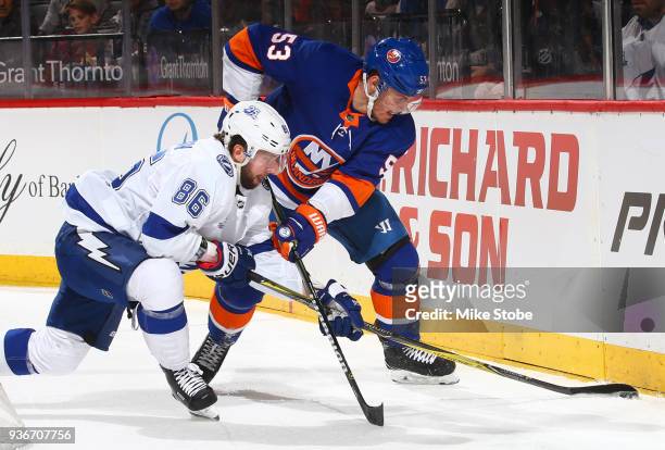 Nikita Kucherov of the Tampa Bay Lightning and Casey Cizikas of the New York Islanders battle for the puck during the second period at Barclays...