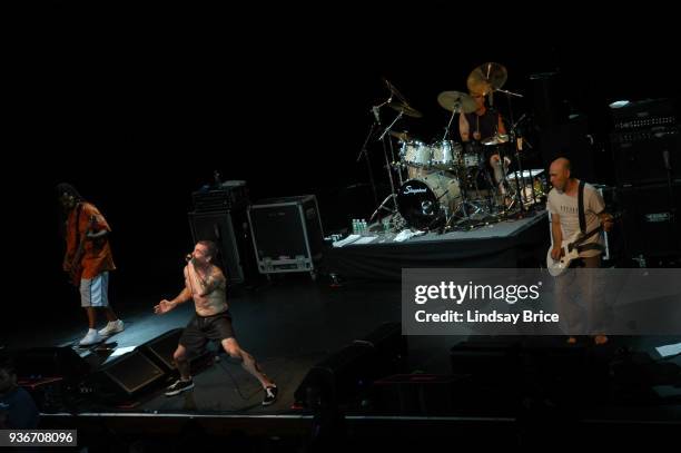 Rollins Band at Nokia Theater. Full stage view from above of Rollins Band fronted by Henry Rollins, his right palm outstretched toward audience, in...