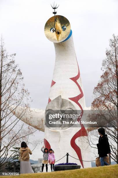 The first public visitors view the recreated sculpture of the 'fourth face' in the 'Tower of the Sun' in the Expo ?'70 Memorial Park on March 19,...