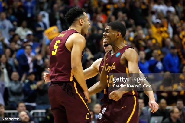 Marques Townes of the Loyola Ramblers reacts with Aundre Jackson after making a late three point basket in the second half against the Nevada Wolf...