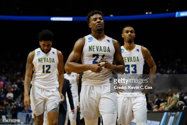 Jordan Caroline of the Nevada Wolf Pack walks off the floor with teammates after being defeated by the Loyola Ramblers during the 2018 NCAA Men's...