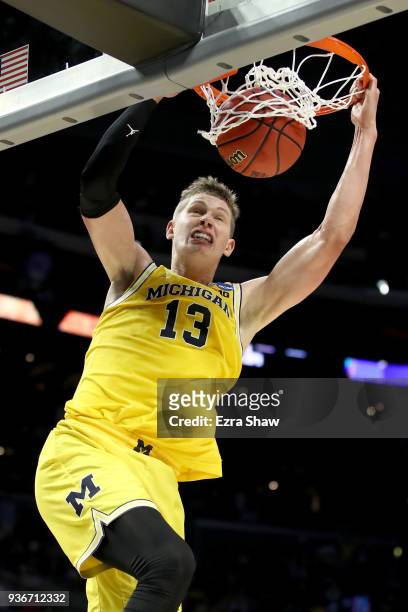 Moritz Wagner of the Michigan Wolverines dunks the ball in the second half while taking on the Texas A&M Aggies in the 2018 NCAA Men's Basketball...