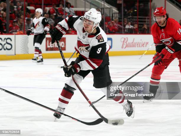 Clayton Keller of the Arizona Coyotes shoots the puck during an NHL game against the Carolina Hurricanes on March 22, 2018 at PNC Arena in Raleigh,...