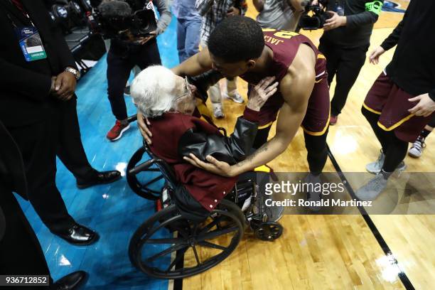 Aundre Jackson of the Loyola Ramblers celebrates with Sister Jean Dolores Schmidt after defeating the Nevada Wolf Pack during the 2018 NCAA Men's...