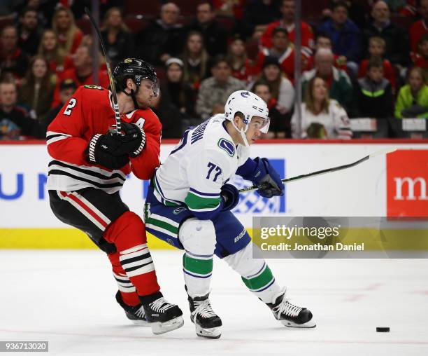 Nikolay Goldobin of the Vancouver Canucks readies to shoot in front of Duncan Keith of the Chicago Blackhawks at the United Center on March 22, 2018...