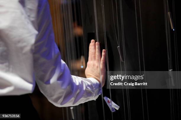 Guest interacts with Water Ripples by Stella Artois, a public kinetic art installation open March 23-26 that visualizes the impact of the brands...