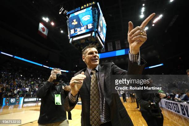 Head coach Porter Moser of the Loyola Ramblers celebrates after defeating the Nevada Wolf Pack during the 2018 NCAA Men's Basketball Tournament South...