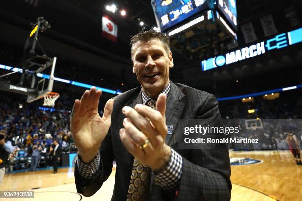 Head coach Porter Moser of the Loyola Ramblers celebrates after defeating the Nevada Wolf Pack during the 2018 NCAA Men's Basketball Tournament South...