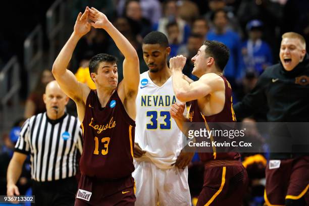 Clayton Custer and Ben Richardson of the Loyola Ramblers celebrate after defeating the Nevada Wolf Pack during the 2018 NCAA Men's Basketball...