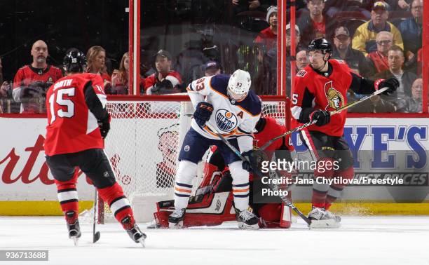 Craig Anderson of the Ottawa Senators makes a toe save against Ryan Nugent-Hopkins of the Edmonton Oilers as Zack Smith and Cody Ceci of the Ottawa...