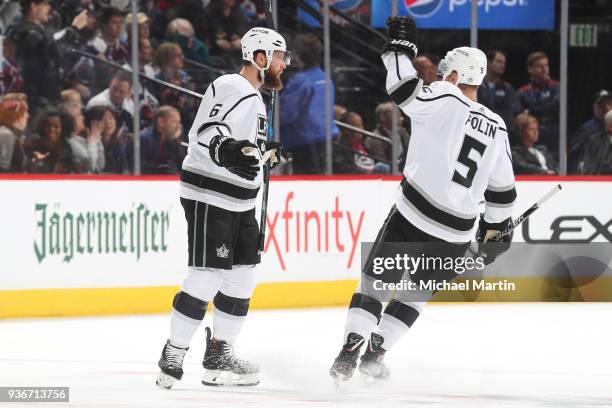 Jake Muzzin of the Los Angeles Kings celebrates a goal against the Colorado Avalanche with teammate Christian Folin at the Pepsi Center on March 22,...