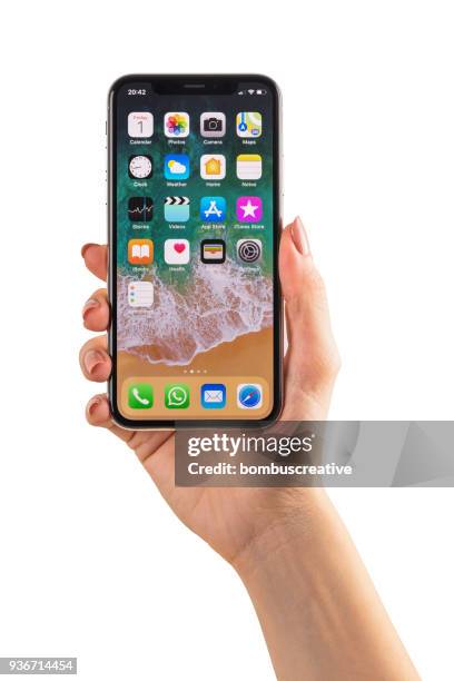 hand hält apple iphone x - iphone x hand stock-fotos und bilder