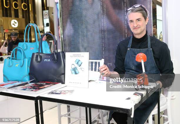 Illustrator Don Oehl personalizes handbags at the InStyle x Michael Kors Style Adventure At Macy's on March 22, 2018 in New York City.