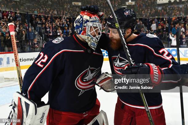 Sergei Bobrovsky of the Columbus Blue Jackets celebrates with teammate Ian Cole of the Columbus Blue Jackets after shutting out the Florida Panthers...