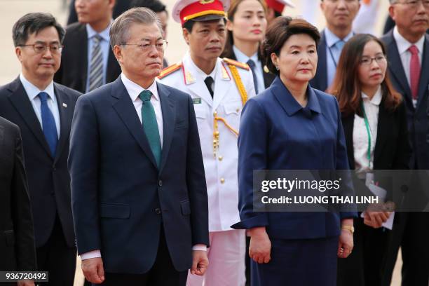 South Korea's President Moon Jae-in and his wife Kim Jung-sook attend a wreath-laying ceremony at the mausoleum of Vietnam's late president Ho Chi...