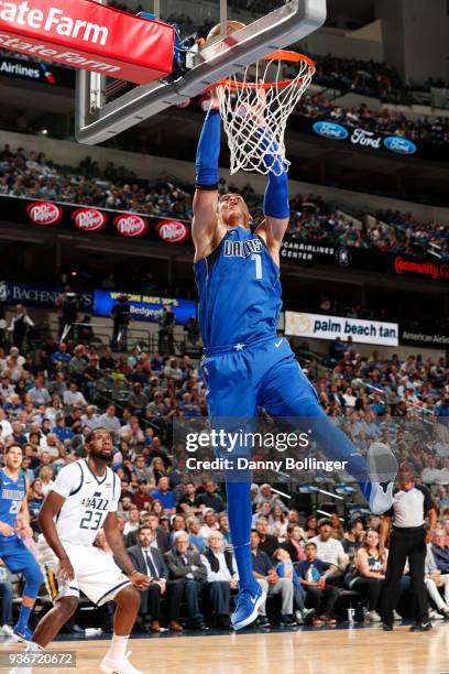 Dwight Powell of the Dallas Mavericks dunks the ball during the game against the Utah Jazz on March 22, 2018 at the American Airlines Center in...