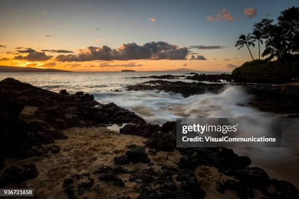 tropical sunset on makena beach in maui. - makena beach stock pictures, royalty-free photos & images