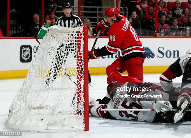 Teuvo Teravainen of the Carolina Hurricanes scores a goal past Darcy Kuemper of the Arizona Coyotes during an NHL game on March 22, 2018 at PNC Arena...