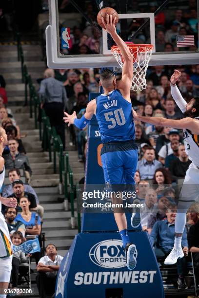 Salah Mejri of the Dallas Mavericks dunks the ball during the game against the Utah Jazz on March 22, 2018 at the American Airlines Center in Dallas,...