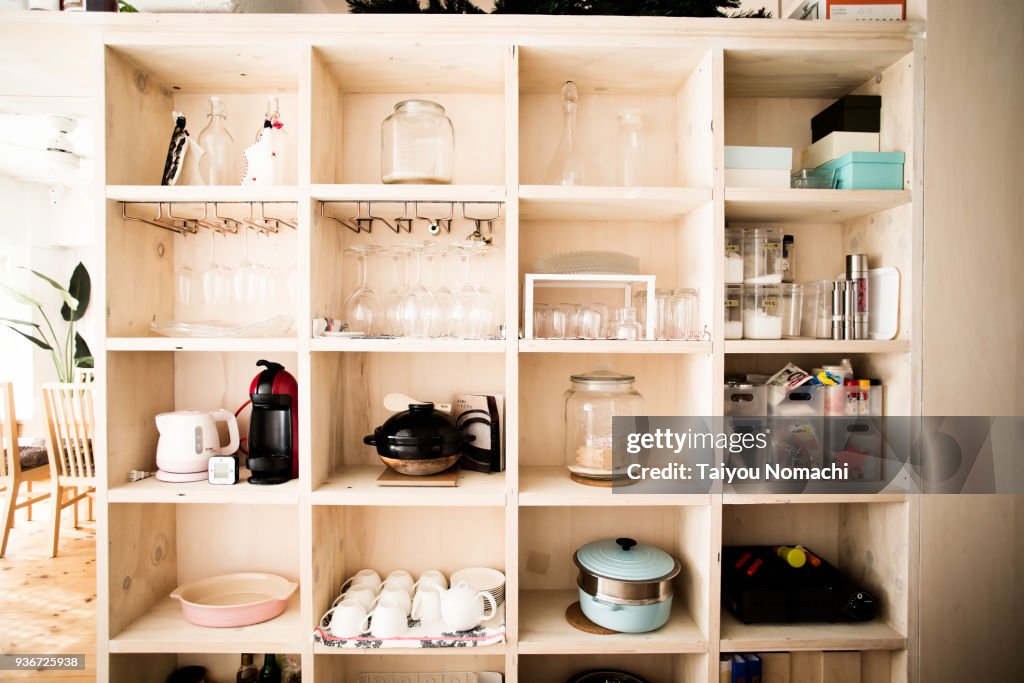 Wooden shelves with dishes arranged