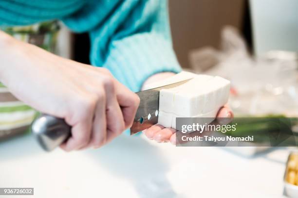 cut tofu on hands - tofu stock pictures, royalty-free photos & images