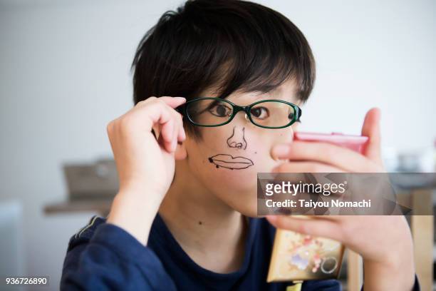 children who paint on face and play - boy funny face ストックフォトと画像