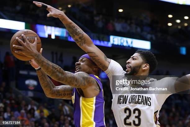 Isaiah Thomas of the Los Angeles Lakers shoots against Anthony Davis of the New Orleans Pelicans during the second half at the Smoothie King Center...