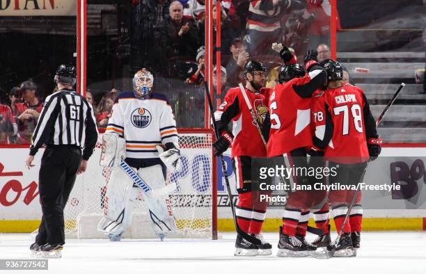 Filip Chlapik of the Ottawa Senators celebrates his third period goal and first career NHL against the Edmonton Oilers with teammates Marian Gaborik...