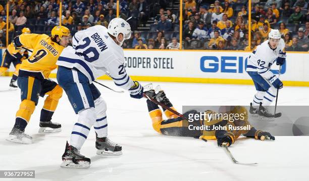 Alexei Emelin of the Nashville Predators blocks the pass against Connor Brown to Tyler Bozak of the Toronto Maple Leafs during an NHL game at...