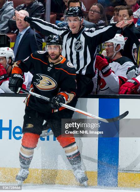 Andrew Cogliano of the Anaheim Ducks reacts as linesman Travis Gawryletz waves play on during the first period of the game against the New Jersey...