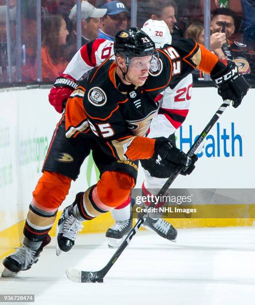Ondrej Kase of the Anaheim Ducks skates with the puck with pressure from Blake Coleman of the New Jersey Devils during the first period of the game...