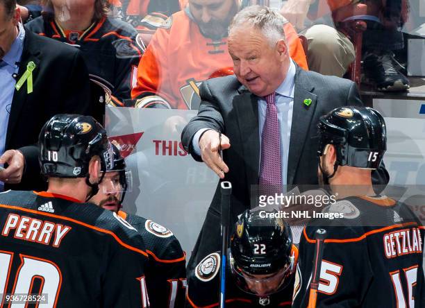 Head coach Randy Carlyle of the Anaheim Ducks gives direction to his players during the second period of the game against the New Jersey Devils at...