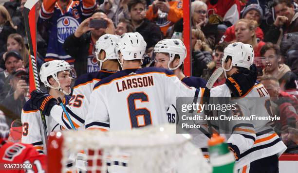 Ryan Nugent-Hopkins of the Edmonton Oilers celebrates his third period goal against the Ottawa Senators with teammates Adam Larsson, Darnell Nurse,...