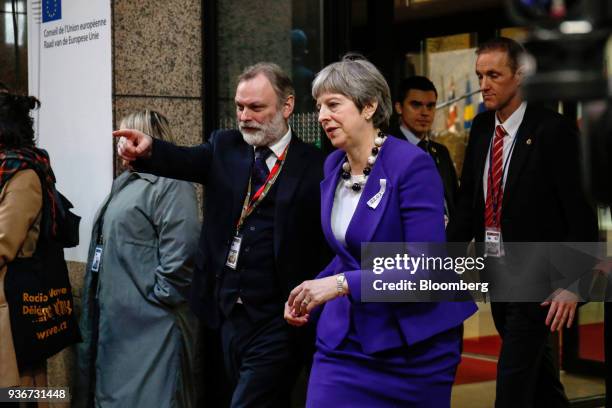 Theresa May, U.K. Prime minister, center right, and Tim Barrow, U.K. Permanent representative to the European Union , center left, leave following...