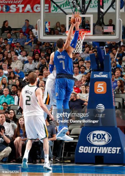 Dwight Powell of the Dallas Mavericks dunks the ball during the game against the Utah Jazz on March 22, 2018 at the American Airlines Center in...