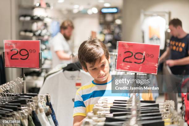 teenage boy in shopping - teenager boy shopping stock-fotos und bilder