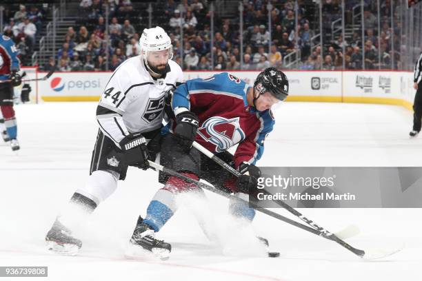 Nate Thompson of the Los Angeles Kings fights for position against Vladislav Kamenev of the Colorado Avalanche at the Pepsi Center on March 22, 2018...
