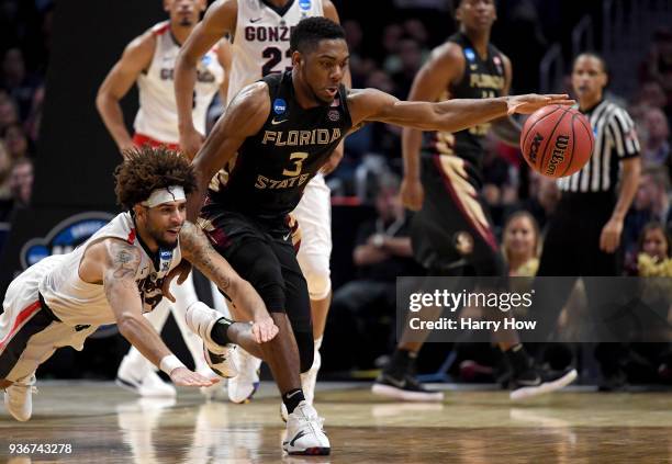 Trent Forrest of the Florida State Seminoles with the ball against Josh Perkins of the Gonzaga Bulldogs in the second half in the 2018 NCAA Men's...