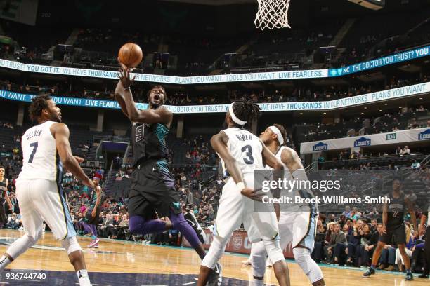 Mangok Mathiang of the Charlotte Hornets goes to the basket against the Memphis Grizzlies on March 22, 2018 at Spectrum Center in Charlotte, North...