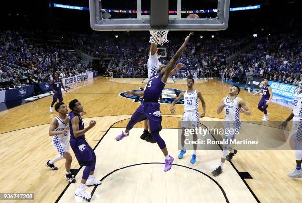 Barry Brown of the Kansas State Wildcats drives to the basket late in the second half for the go-ahead basket against PJ Washington of the Kentucky...