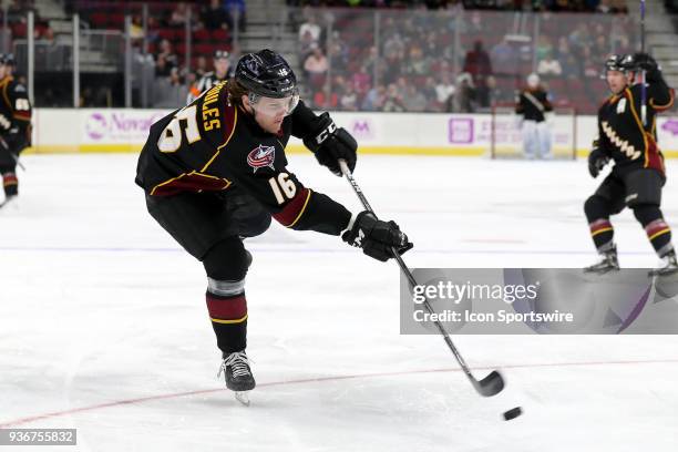 Cleveland Monsters right wing Miles Koules shoots the puck during the second period of the American Hockey League game between the Chicago Wolves and...