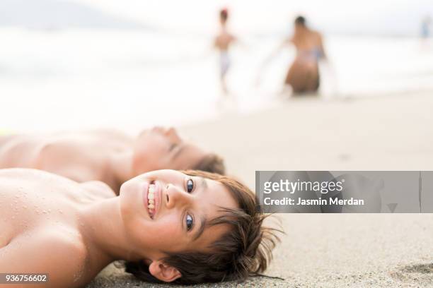 Children on beach sand