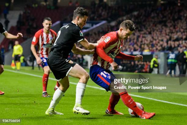 Lucas Hernandez of Atletico de Madrid fights for the ball with Sebastien Corchia of Sevilla FC during the Copa del Rey 2017-18 match between Atletico...