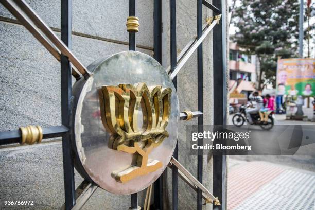 The logo of the Bharatiya Janata Party is displayed on a gate at the party's office in Bengaluru, Karnataka, India, on Wednesday, March 14, 2018....