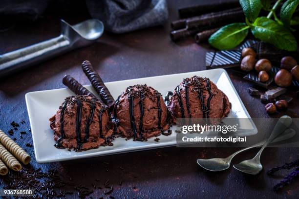 chocolate ice cream still life - dessert topping stock pictures, royalty-free photos & images