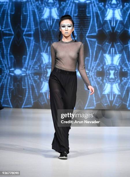 Model walks the runway wearing Phased by LJ at 2018 Vancouver Fashion Week - Day 3 on March 21, 2018 in Vancouver, Canada.